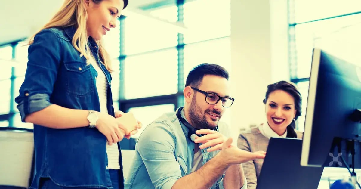 A team reviewing the benefits of cloud ERP software