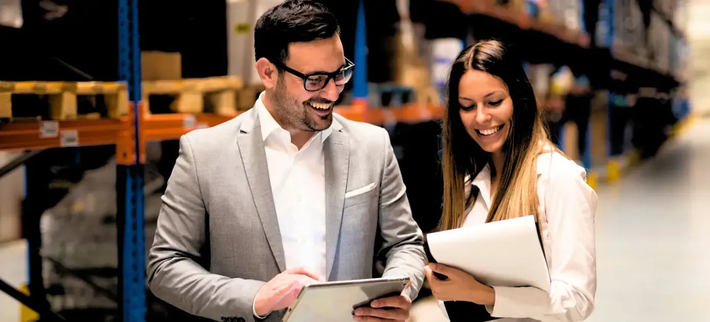 Finance and operations leaders reviewing cloud ERP reporting dashboards